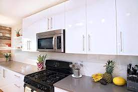 your kitchen with white kitchen cabinets