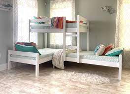 A bunk bed is a type of bed in which one bed frame is stacked on top of another, allowing two or more beds to occupy the floor space usually required by just one. Nora Corner Triple Bunk Bed Customkidsfurniture Com