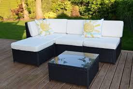 The set consists of two separate sofas that form the corner and three extra stools so you can easily position the furniture to suit any occasion. Cadiz Garden Rattan Corner Sofa Set With Table Grey
