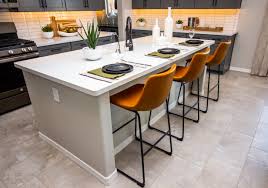 a kitchen island with a slide in stove