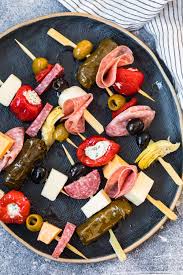Cured meats, olives, pepperoncini, anchovies, artichoke hearts. Easy Antipasto Skewers Holiday Appetizer Idea How To Video