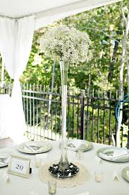 Vases come in many sizes from tiny to 3 feet tall or more. Flower Arrangements In Tall Trumpet Vases With Baby S Breath