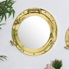 metal porthole mirror in gold 38cm x 38cm