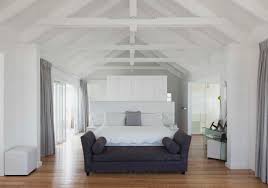 white vaulted wood beam ceiling over