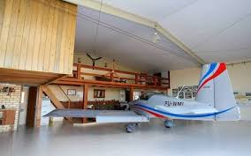 Neat Airplane Hangar Home Designs