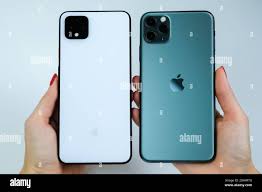 Google Pixel 4 XL in clearly white color and iPhone 11 Pro Max in midnight  green Stock Photo - Alamy