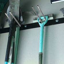 forks shovels and rakes holder wall