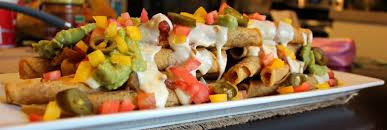 loaded taquitos and queso blanco dip