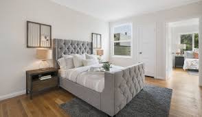 place a rug in a bedroom correctly