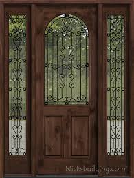 rustic entry door with wrought iron