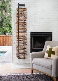 White Brick Fireplace And Stacked Wood