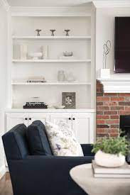 Red Brick Fireplace With White Mantel
