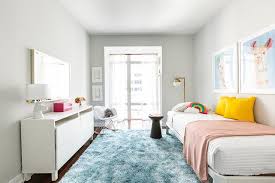 Blue Rug With White Twin Bed