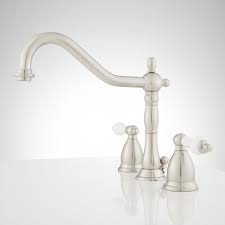 Want an authentic historical bathroom? Victorian Widespread Bathroom Faucet Porcelain Lever Handles Bathroom Sink Faucets Faucets