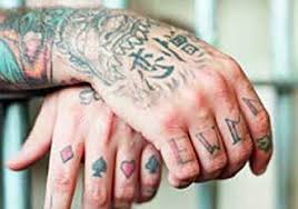 Some designs portray a spade in the center of the card or a skull. 15 Notorious Prison Tattoos And Their Hidden Meaning Explained