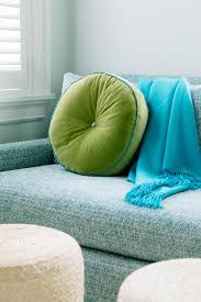 blue sofa with lime green pillow