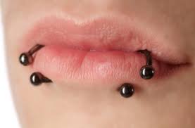 types of lip piercings roll and
