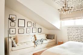 bedroom that has a sloped roof