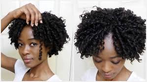 Half up half down dreadlocks hairstyle with messy bun and parted wavy bangs; 20 Best Soft Dreadlocks Hairstyles In Kenya Tuko Co Ke