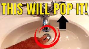 fix a stuck push down sink plug