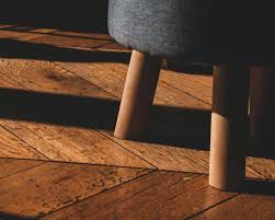how to fix wood floor buckling without