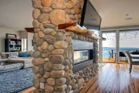 river rock fireplace in sound view home