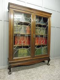 oak bookcase with art deco glass doors