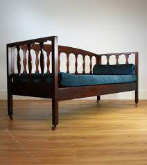 An Arts Crafts Mahogany Sofa Bed