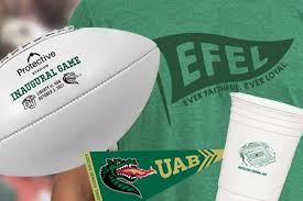 UAB National Alumni Society - Getting ready for the new football season?  Your 2021 Spirit Box includes a mini commemorative football, green EFEL  shirt, cup with stadium image, and pennant magnet...all for