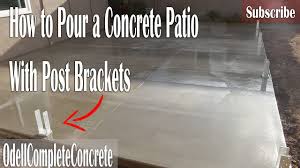 concrete patio with post brackets