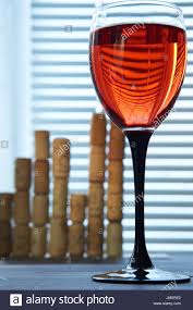Bottom Closeup Shot Of Red Wine Glass With Graph Chart Made