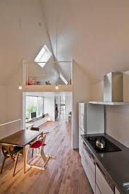 Triangle house with three level atrium. Small House Design Taking Advantage Of Triangular Lot And Offering Modern Interiors