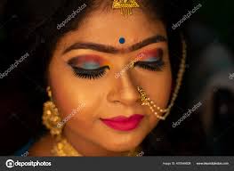 indian showing her eye makeup