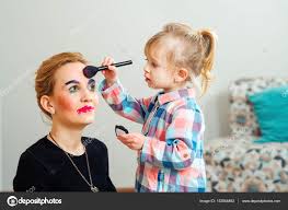 cute little are doing makeup for