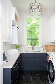 navy blue laundry room cabinets with
