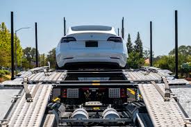 tesla 7 500 to take delivery