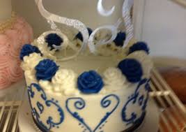 Nothing is truly symmetrical, nothing perfectly placed, everything simply seems as if it's been handmade just for your wedding. Wedding Cakes Royal Blue Wedding Cakes With Flowers