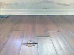 how to deal with water damage wood floors