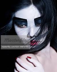 young woman with dramatic makeup black