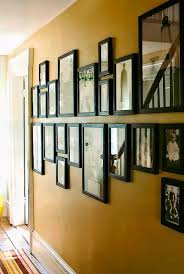 display framed photographs on a wall
