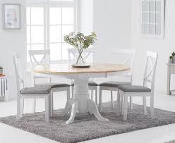 While you're browsing our trendy selection of white dining room chairs, use our filter options to discover all the dining room chairs colors, sizes, materials, styles, and more we have to offer. Epsom Oak And White Round Pedestal Extending Table With Epsom Chairs With Grey Fabric Seats Oak And White 4 Chairs 819 00 Save Up To 20 Off