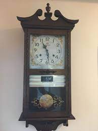 vintage wall clock with pendulum 20th