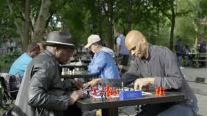 two men playing chess at tables in Washington Square Park in Spring - – NY  Clips