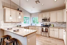 To make the kitchen look more lavish, you can play with the colours that complement the cabinets well. Antique White Kitchen Cabinets Craftsman Kitchen Los Angeles By The Cabinet Spot Inc Houzz