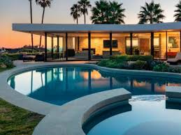 Elon has frequently stayed either literally in a sleeping bag on the factory floor or on a couch in a conference room many times. Elon Musk Sells Incredible La Spaceship Shaped Mansion With Giant Moat Swimming Pool Realestate Com Au
