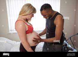 pregnant white girl with black partner Stock Photo - Alamy