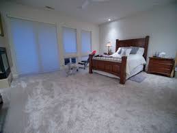 modern master bedroom with grey carpet