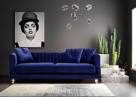 blue velvet sofa in a living room