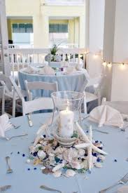 The right wedding decorations mean the difference between a rustic wedding and a luxury hotel wedding. Elegant Table Decor For A Beach Wedding Theme Beach Wedding Centerpieces Beach Theme Centerpieces Beach Wedding Decorations