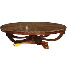 This round coffee table owns an aluminium frame and is accented with durable synthetic woven rattan. Sunburst Round Mahogany Coffee Table With Inlaid Top Akd Furniture